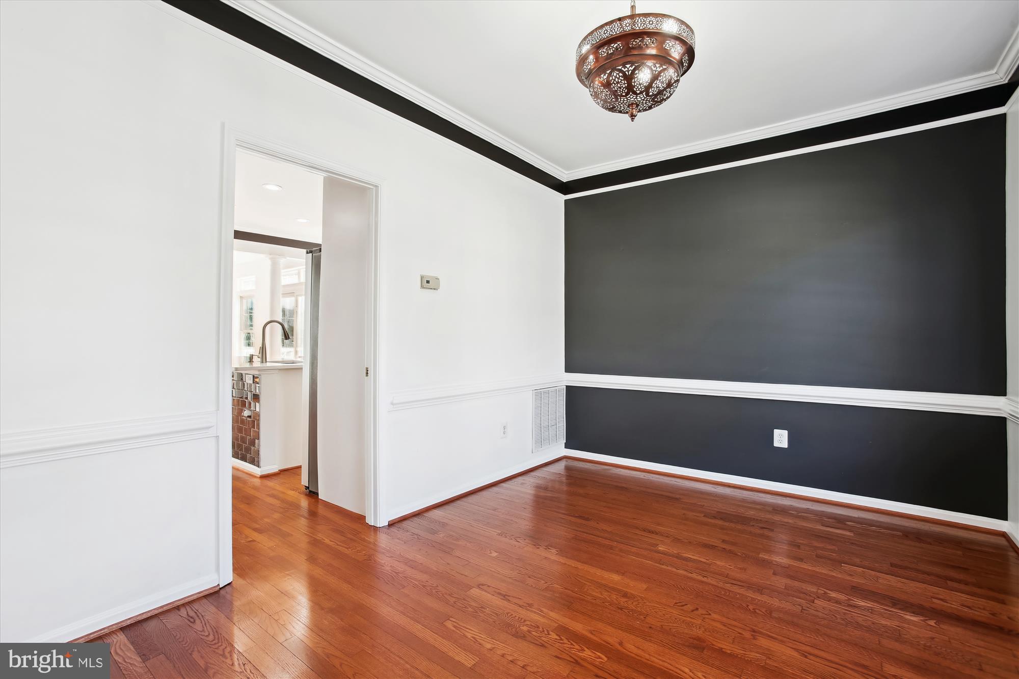 6103 Deer Ridge Trail Springfield, VA 22150 - Photo 7 of 36 a view of a livingroom with wooden floor