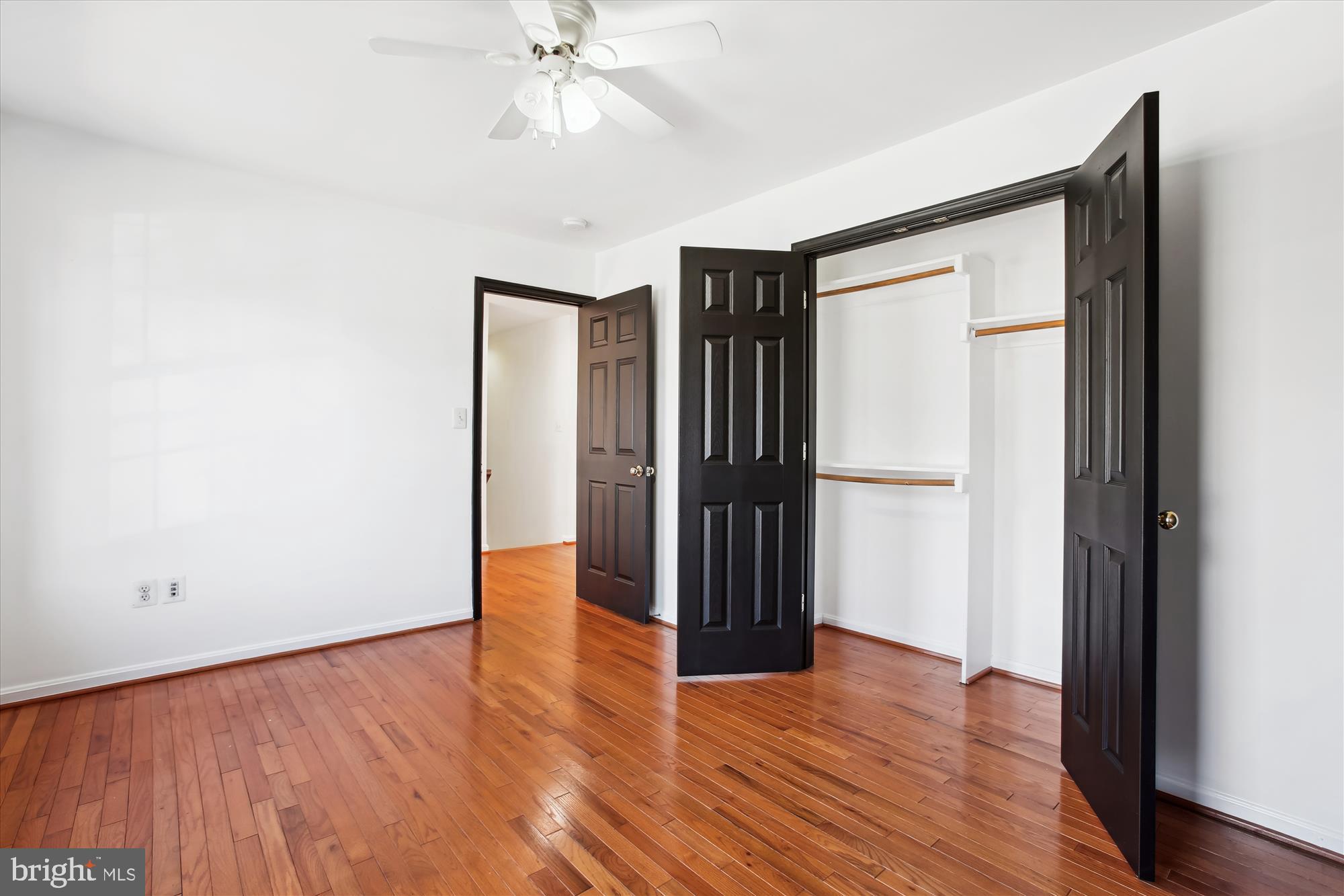 6103 Deer Ridge Trail Springfield, VA 22150 - Photo 10 of 36 a view of an empty room with wooden floor and a window