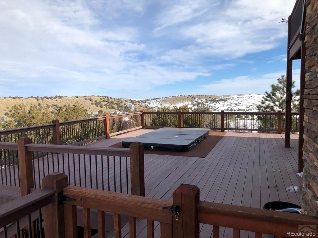 9780 Canyon Point Drive Rye, CO 81069 - Photo 13 of 35 a view of a balcony with wooden floor and city view