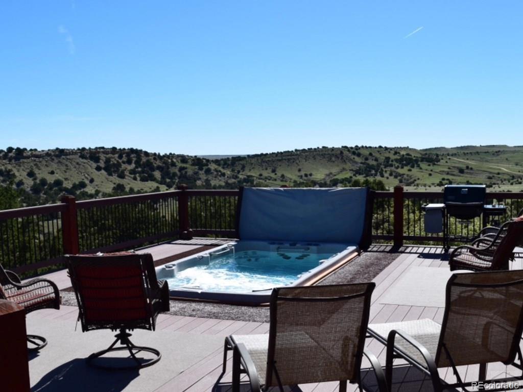 9780 Canyon Point Drive Rye, CO 81069 - Photo 23 of 35 a view of a chairs and table in patio