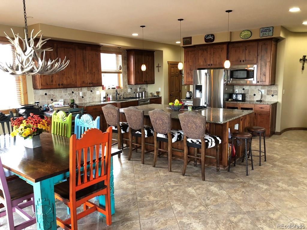 9780 Canyon Point Drive Rye, CO 81069 - Photo 29 of 35 a group of dining room and kitchen view