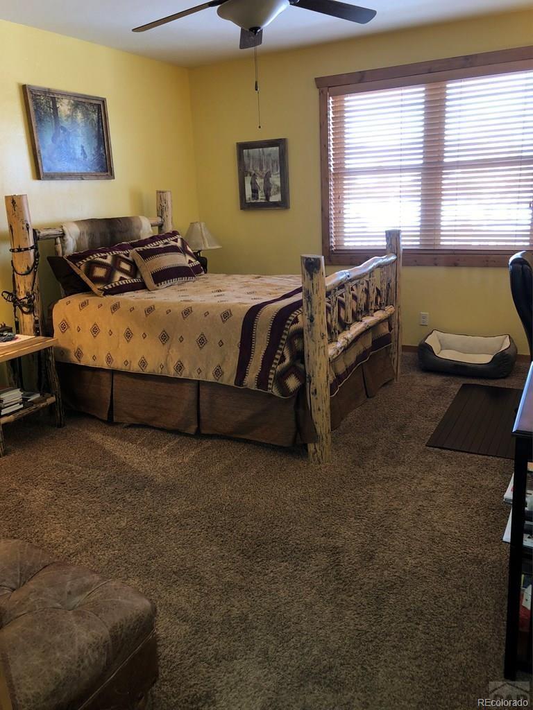 9780 Canyon Point Drive Rye, CO 81069 - Photo 4 of 35 a bedroom with a bed and a window