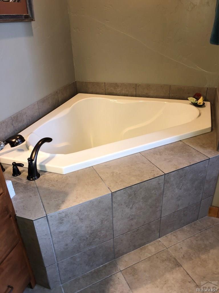 9780 Canyon Point Drive Rye, CO 81069 - Photo 7 of 35 a bathroom with a bathtub
