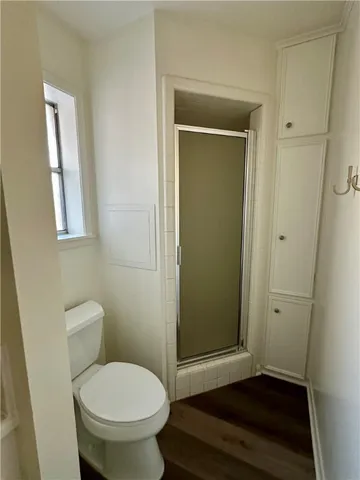 wooden floor with a fireplace in it