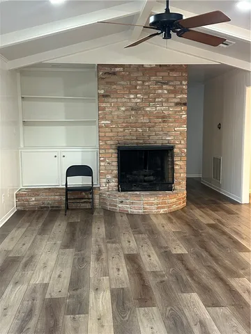 a kitchen with a refrigerator and cabinets