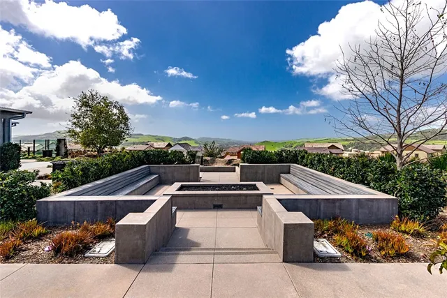 a view of a swimming pool with lounge chairs