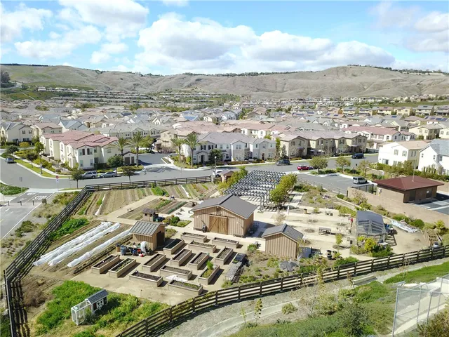 a view of a patio with a table chairs and a yard