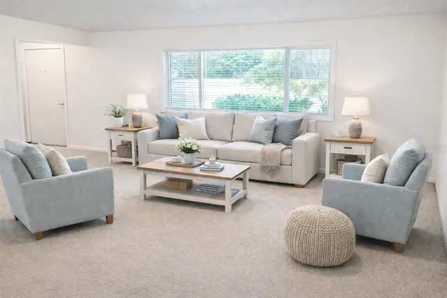 a view of a kitchen with a sink and refrigerator