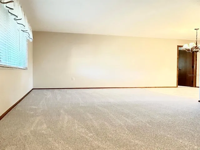 a view of a kitchen with granite countertop cabinets and window