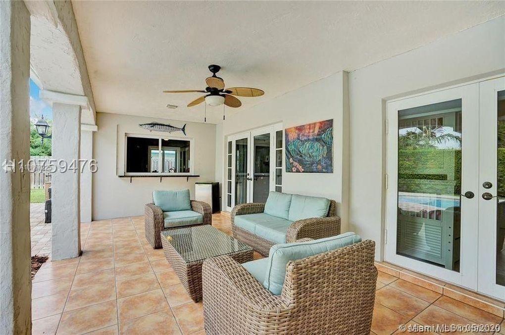 261 Northwest 11th Avenue Boca Raton, FL 33486 - Photo 6 of 14 a living room with furniture and a flat screen tv