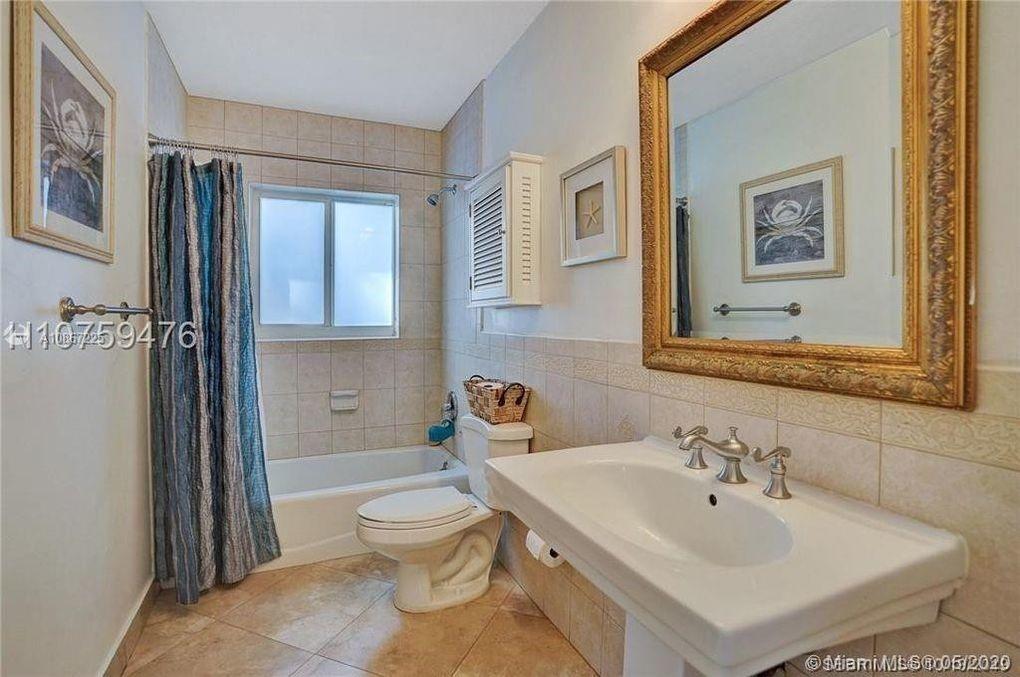 261 Northwest 11th Avenue Boca Raton, FL 33486 - Photo 7 of 14 a bathroom with a sink toilet and shower