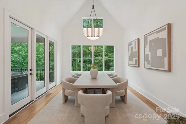 a dining room with furniture and a window