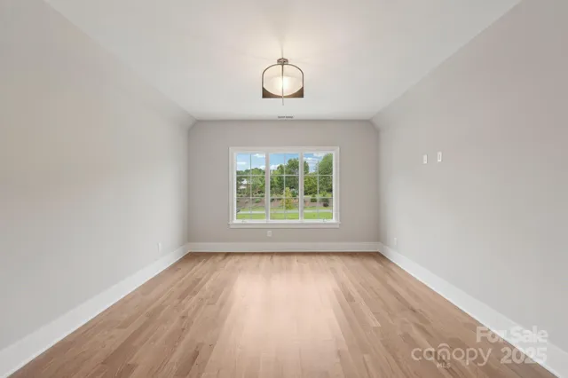 a bathroom with a shower sink and mirror