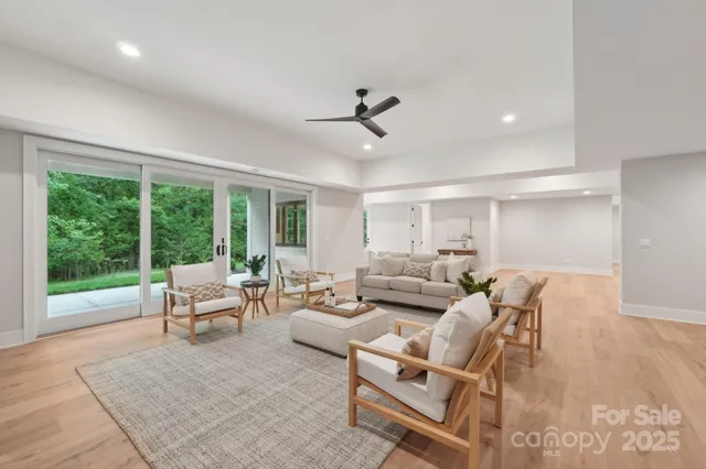 a bathroom with a granite countertop shower a sink and a mirror