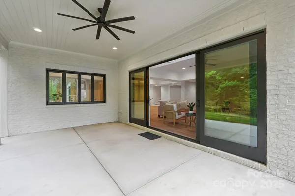 a view of a house with a yard and sitting space