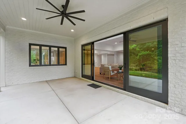 a view of a house with a yard and sitting space