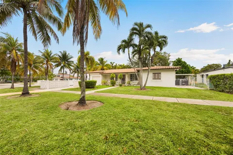 a front view of a house with swimming pool