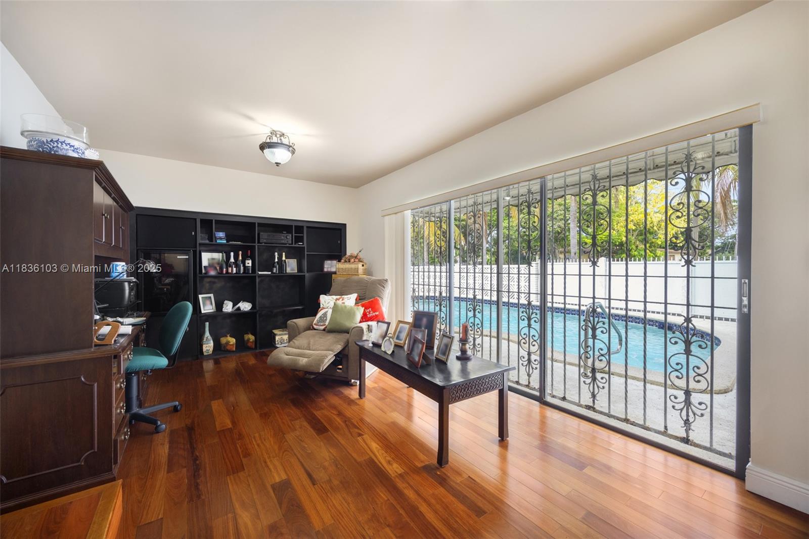 811 Southwest 25th Road Miami, FL 33129 - Photo 13 of 23 a living room with furniture and a wooden floor