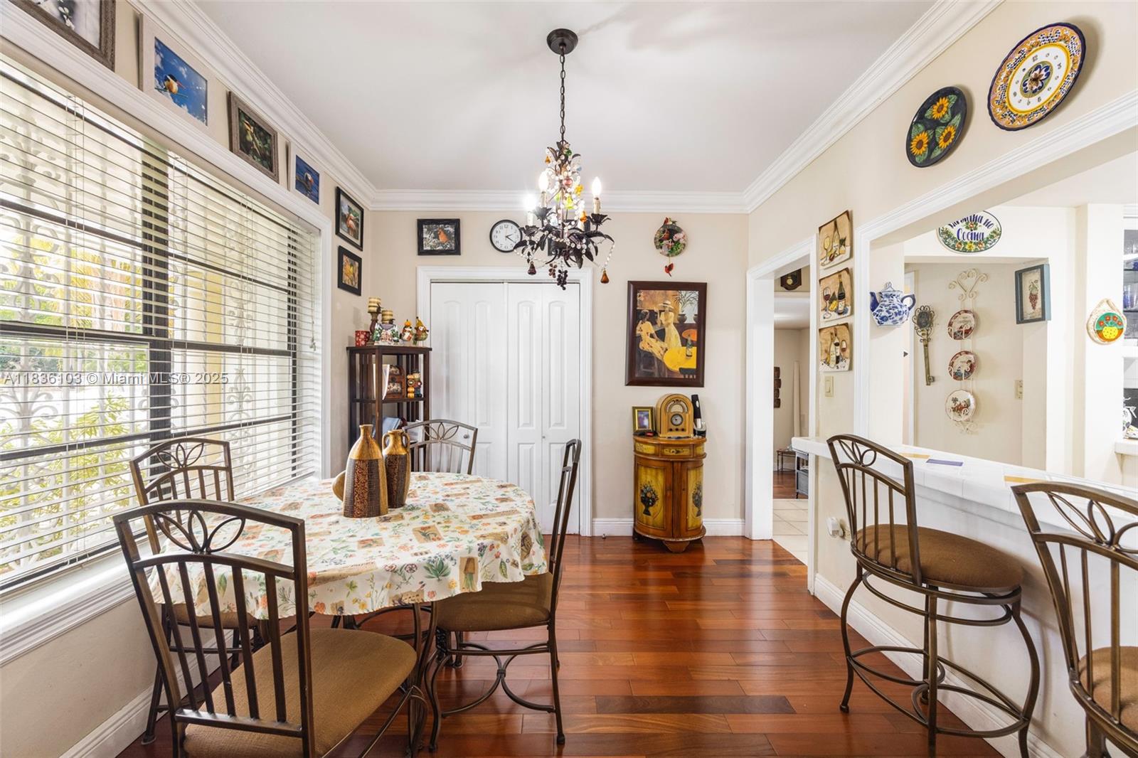 811 Southwest 25th Road Miami, FL 33129 - Photo 14 of 23 a view of a dining room with furniture and chandelier