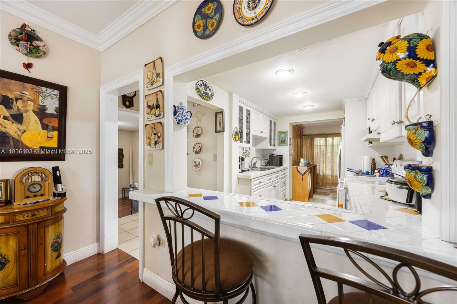 811 Southwest 25th Road Miami, FL 33129 - Photo 15 of 23 a dining room with furniture entryway and wooden floor