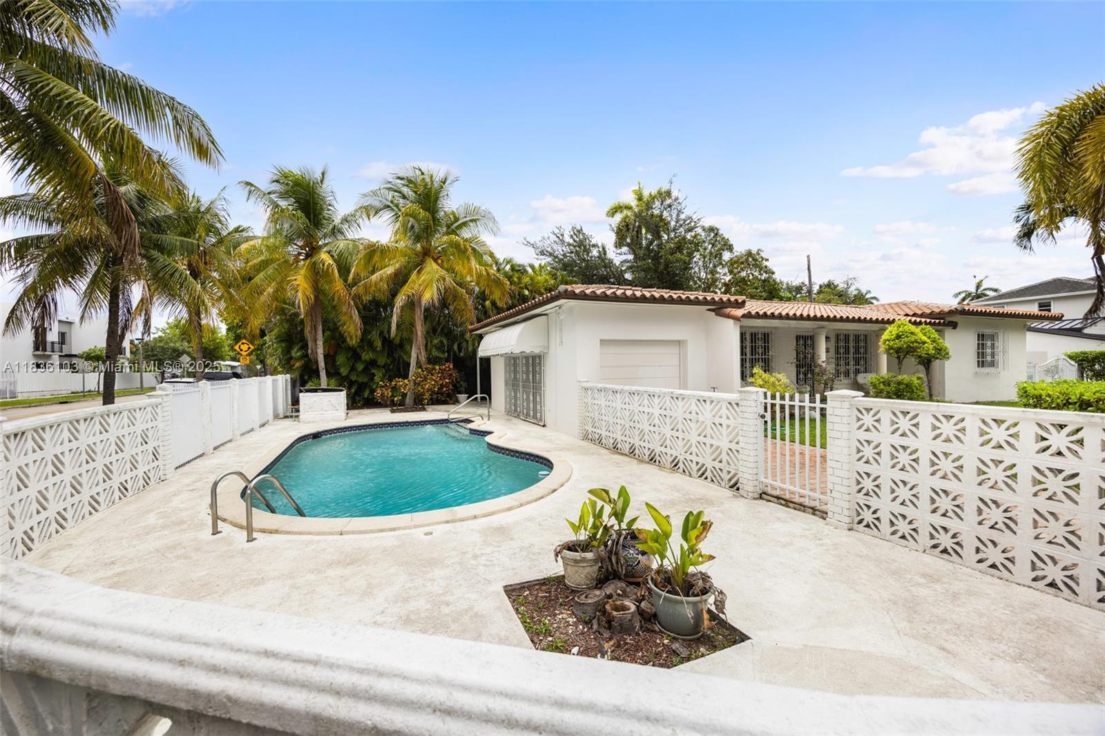 811 Southwest 25th Road Miami, FL 33129 - Photo 22 of 23 a view of a backyard with potted plants