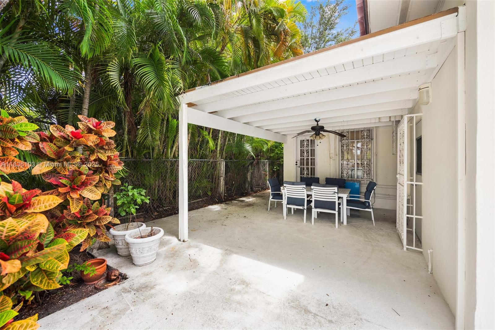 811 Southwest 25th Road Miami, FL 33129 - Photo 23 of 23 a view of a patio with table and chairs and potted plants