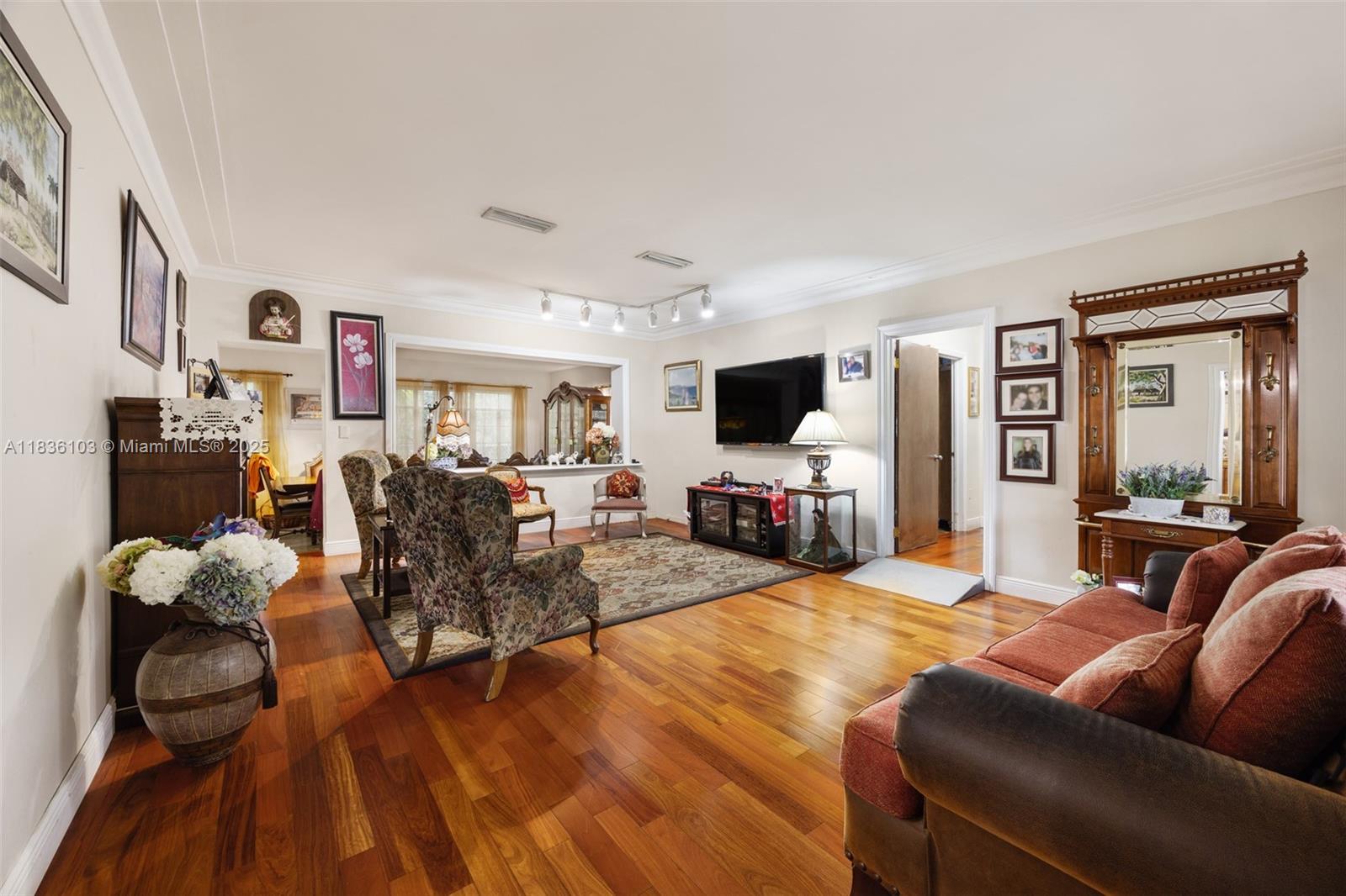 811 Southwest 25th Road Miami, FL 33129 - Photo 7 of 23 a living room with furniture and a flat screen tv
