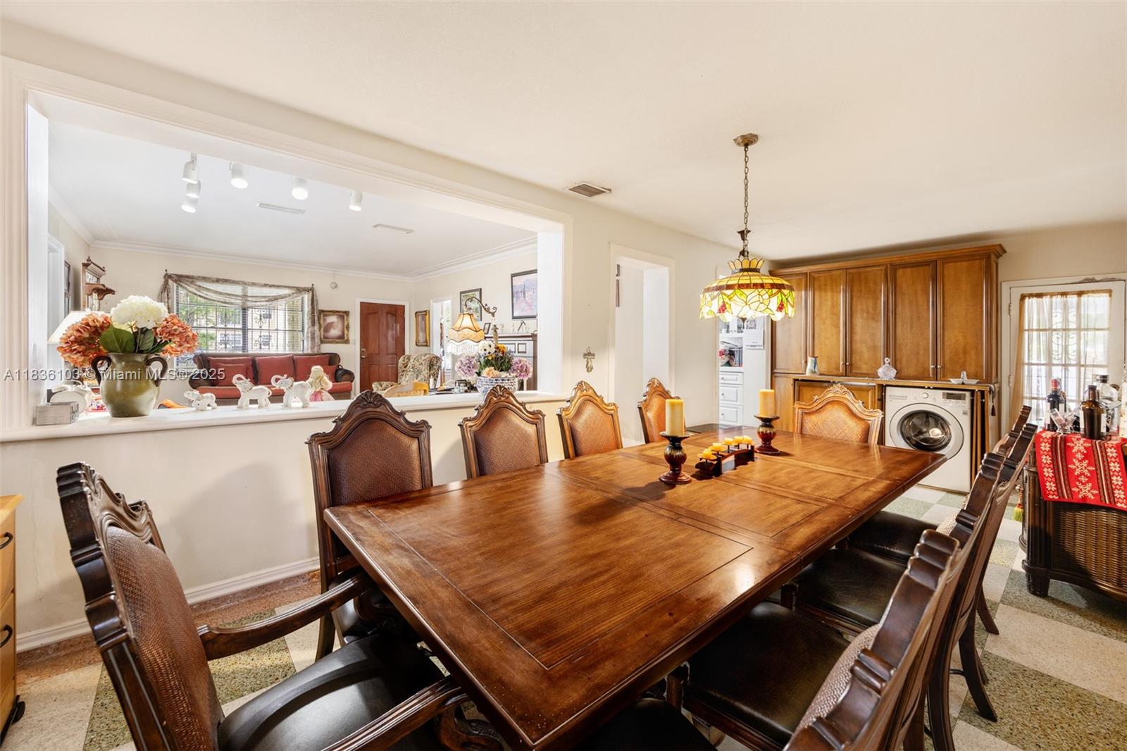 811 Southwest 25th Road Miami, FL 33129 - Photo 9 of 23 a dining room with furniture a rug and wooden floor