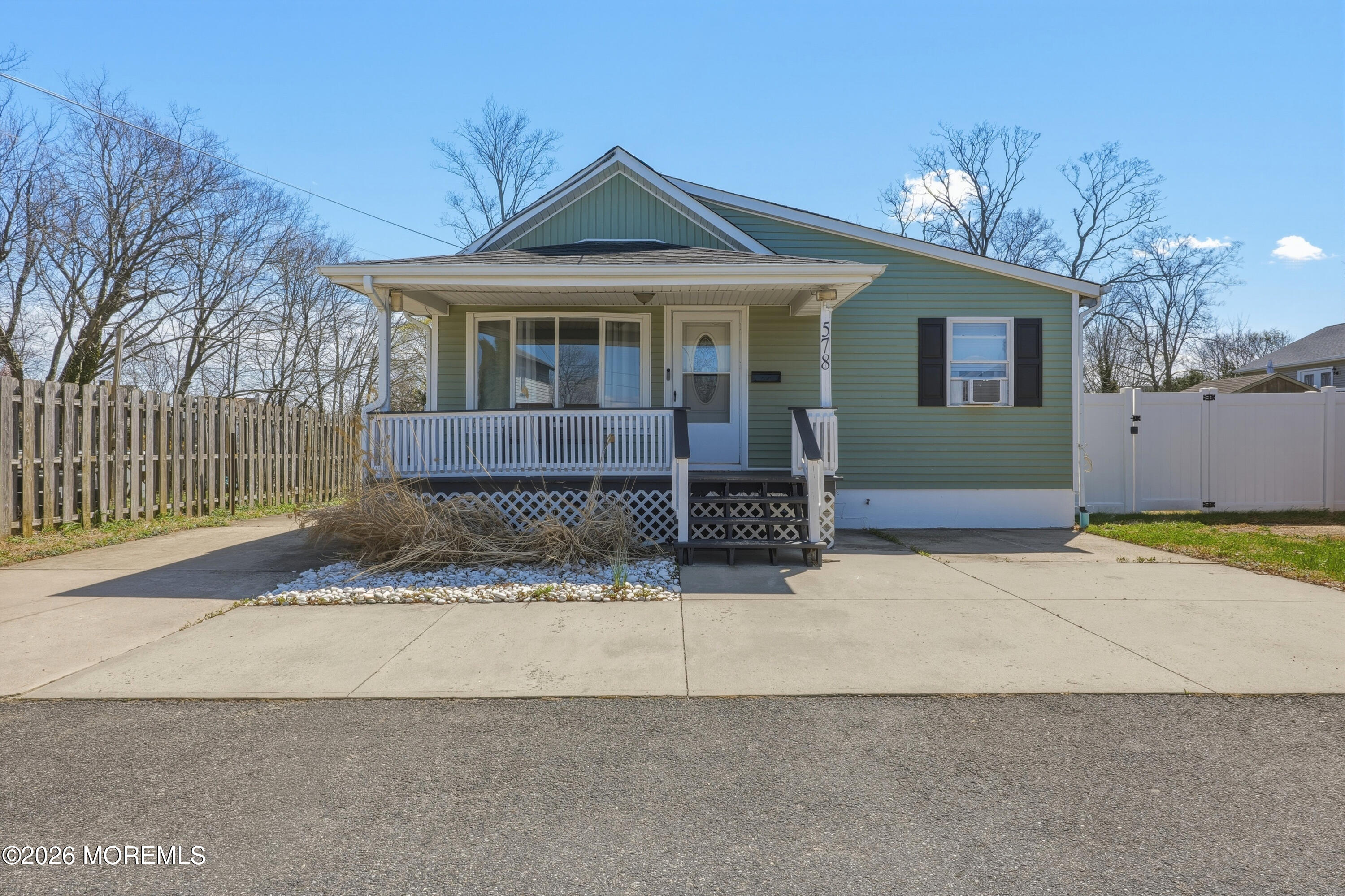 578 High Street Long Branch, NJ 07740 - Photo 1 of 37 a front view of a house with a yard and garage