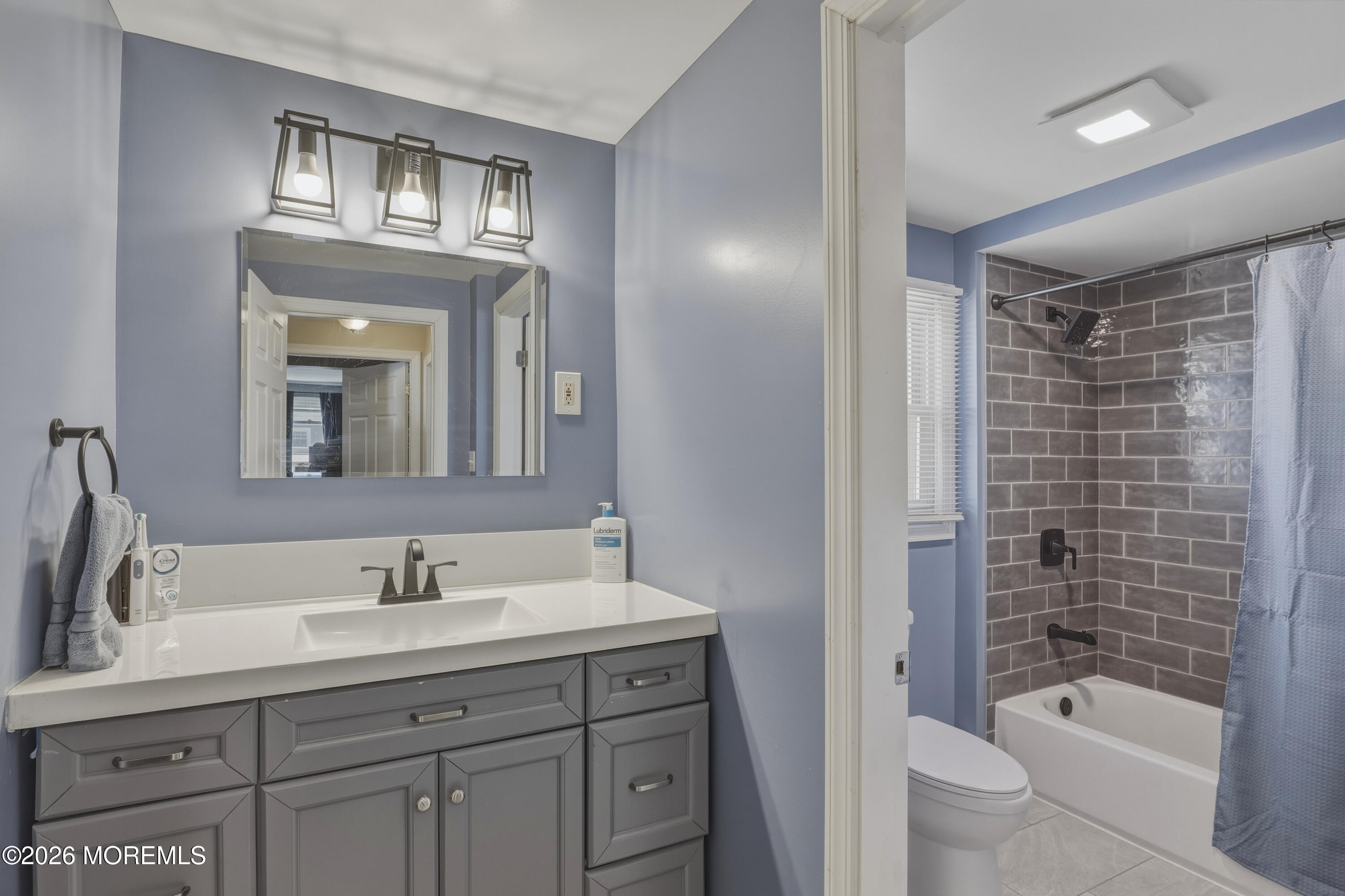 578 High Street Long Branch, NJ 07740 - Photo 13 of 37 a bathroom with a bathtub shower sink vanity and toilet