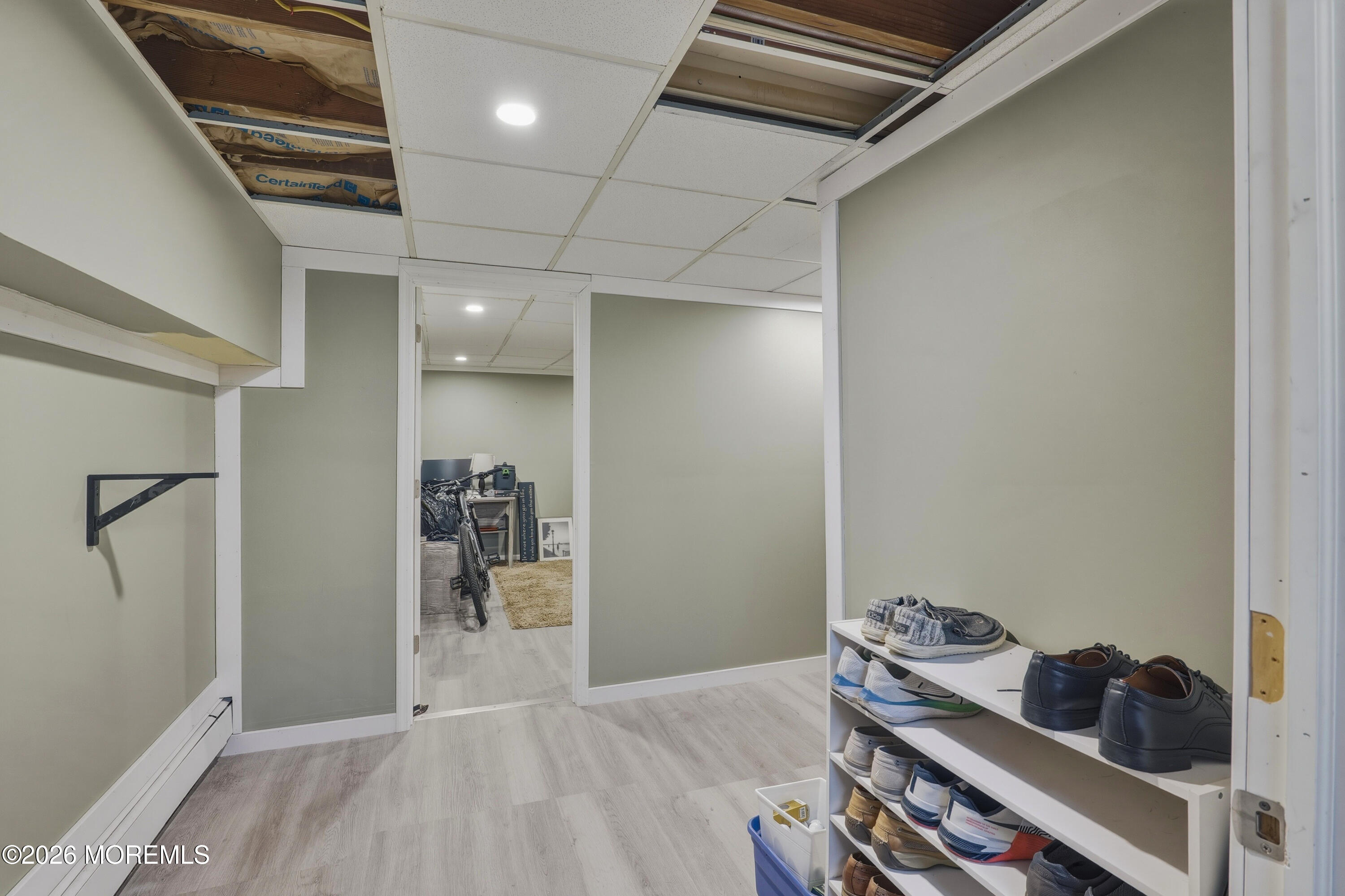 578 High Street Long Branch, NJ 07740 - Photo 19 of 37 a room with wooden floor and shoes
