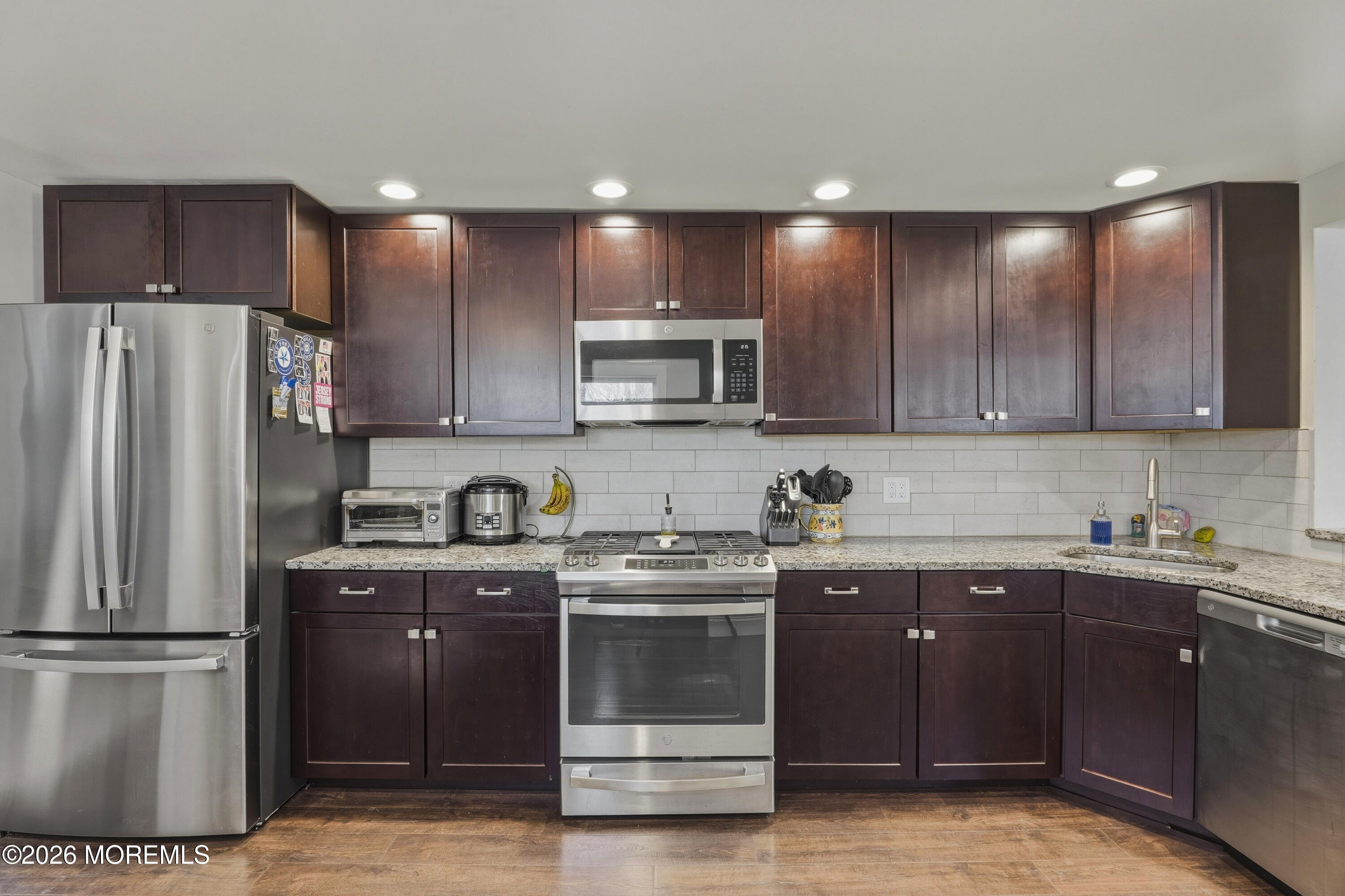 578 High Street Long Branch, NJ 07740 - Photo 4 of 37 a kitchen with stainless steel appliances granite countertop a stove a refrigerator and a sink