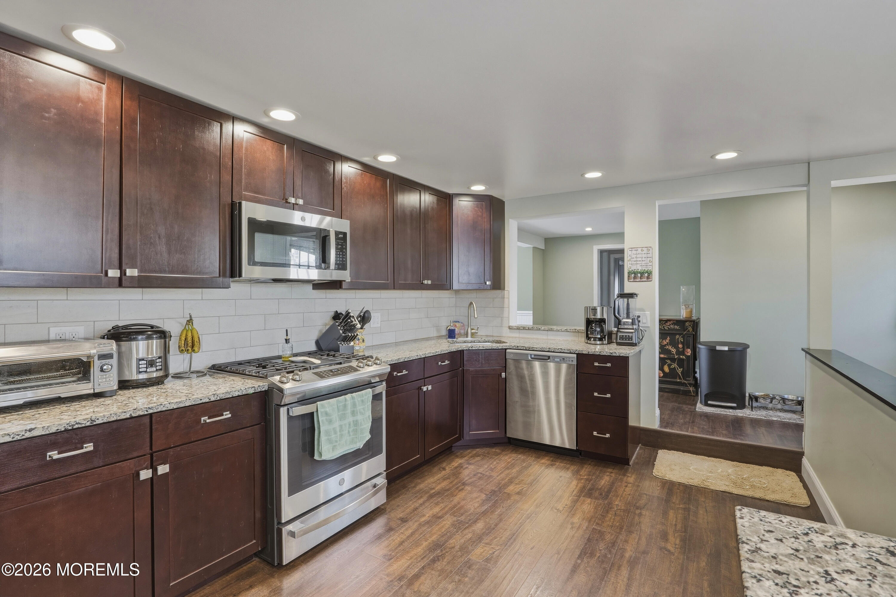 578 High Street Long Branch, NJ 07740 - Photo 5 of 37 a kitchen with a sink stove and cabinets