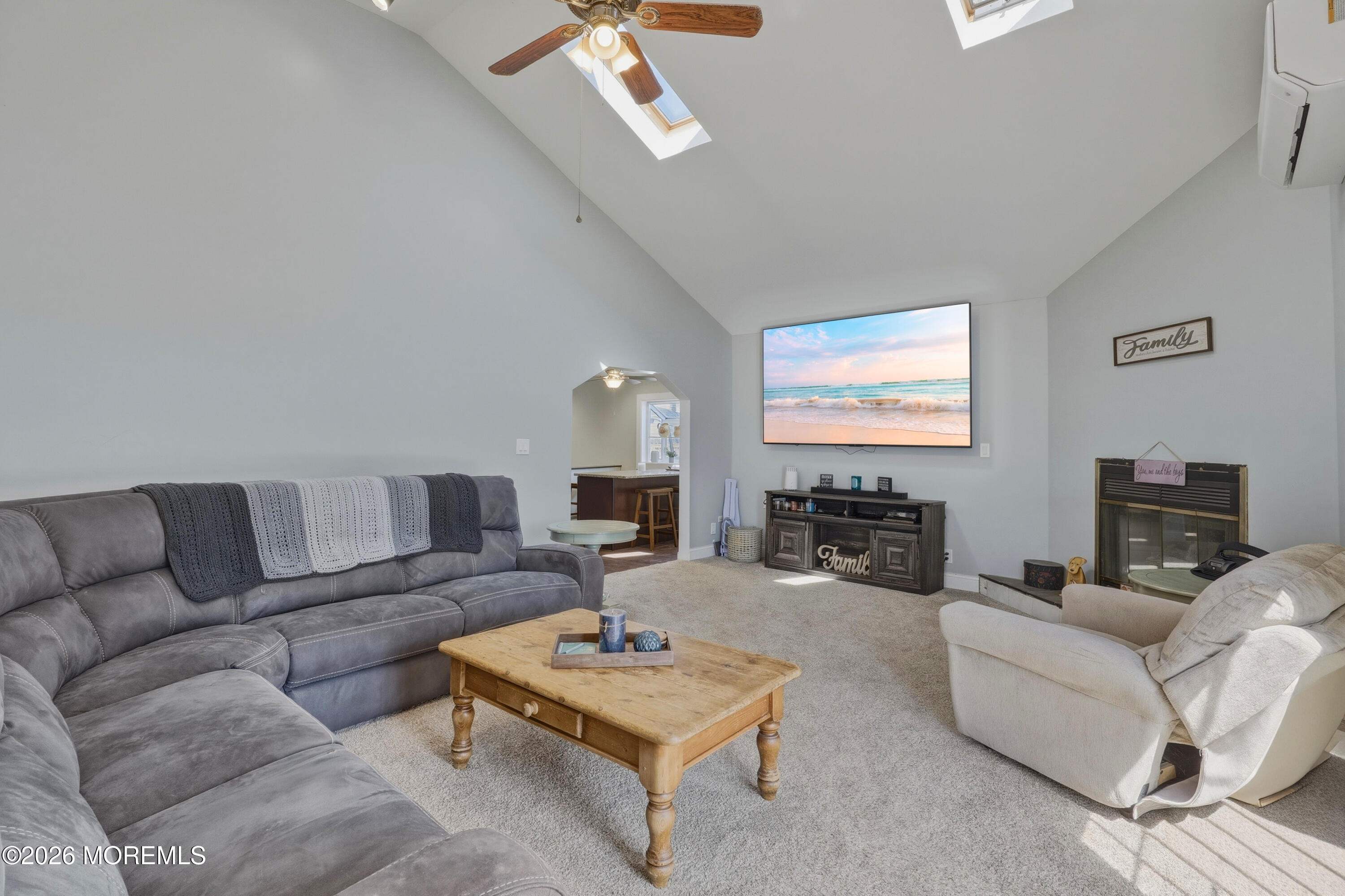 578 High Street Long Branch, NJ 07740 - Photo 8 of 37 a living room with furniture a flat screen tv and a fireplace