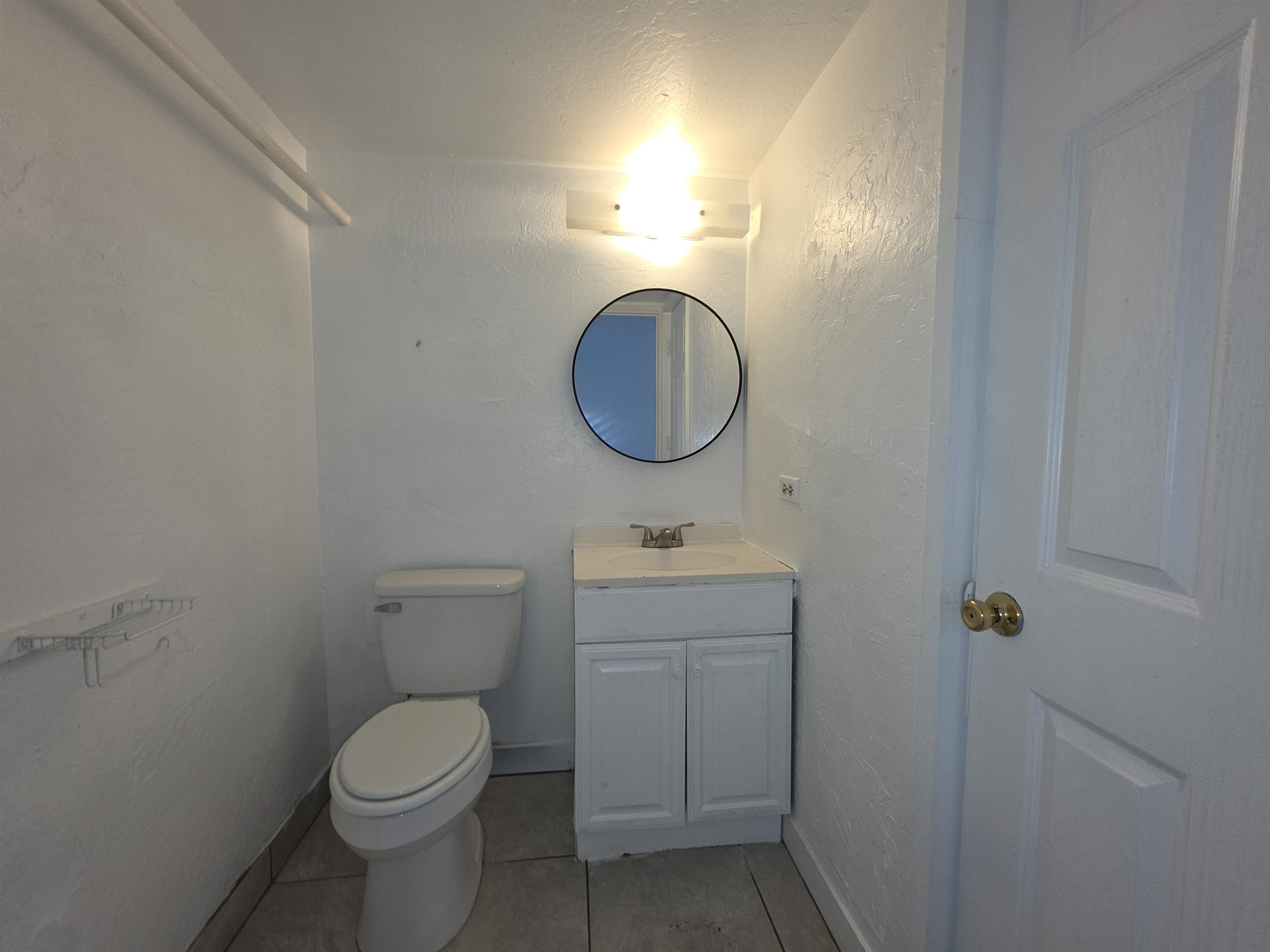 111 Kahului Beach Road, Unit B306 Kahului, HI 96732 - Photo 13 of 29 a bathroom with a toilet a sink and mirror