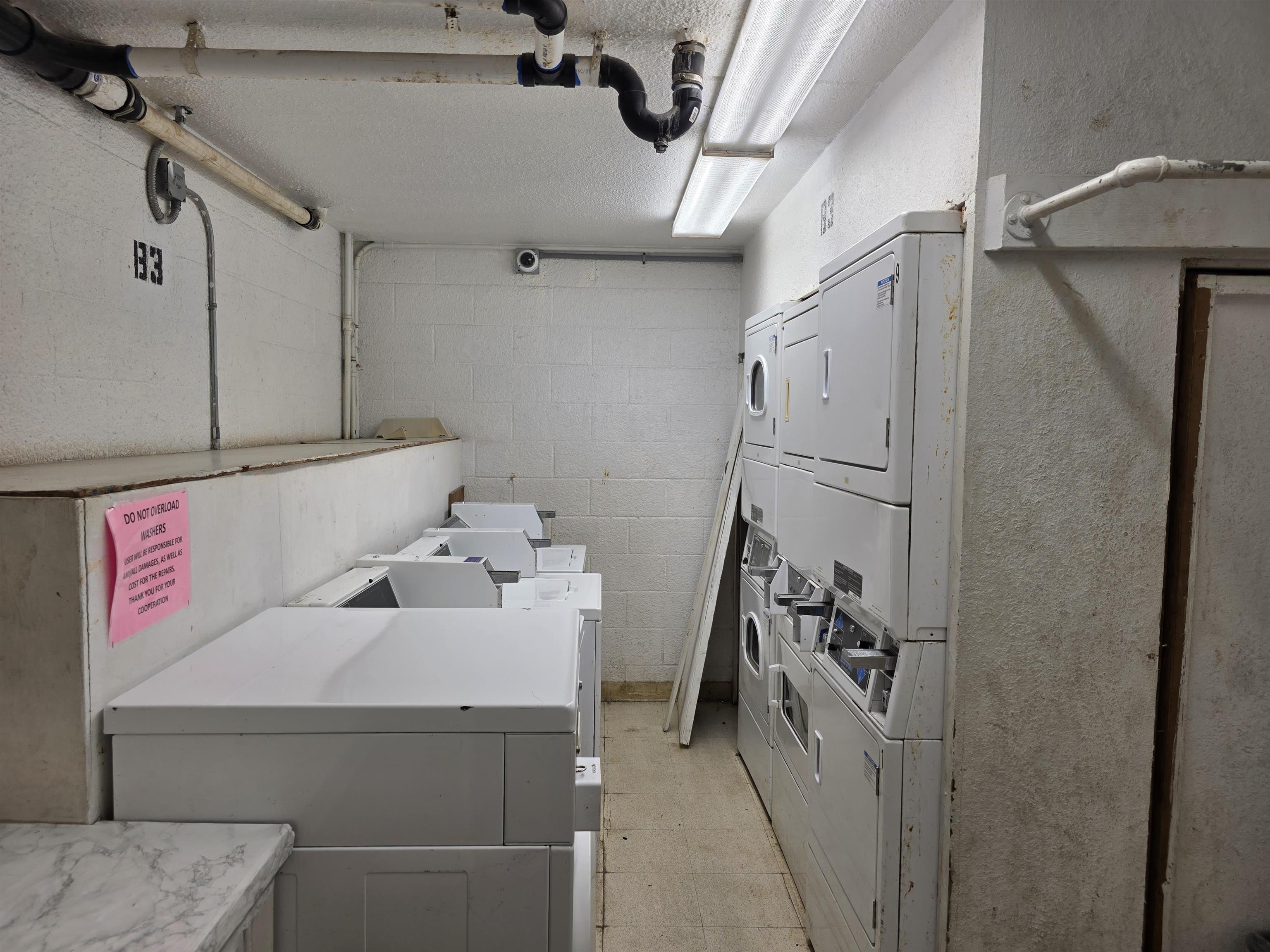 111 Kahului Beach Road, Unit B306 Kahului, HI 96732 - Photo 16 of 29 a utility room with dryer and washer