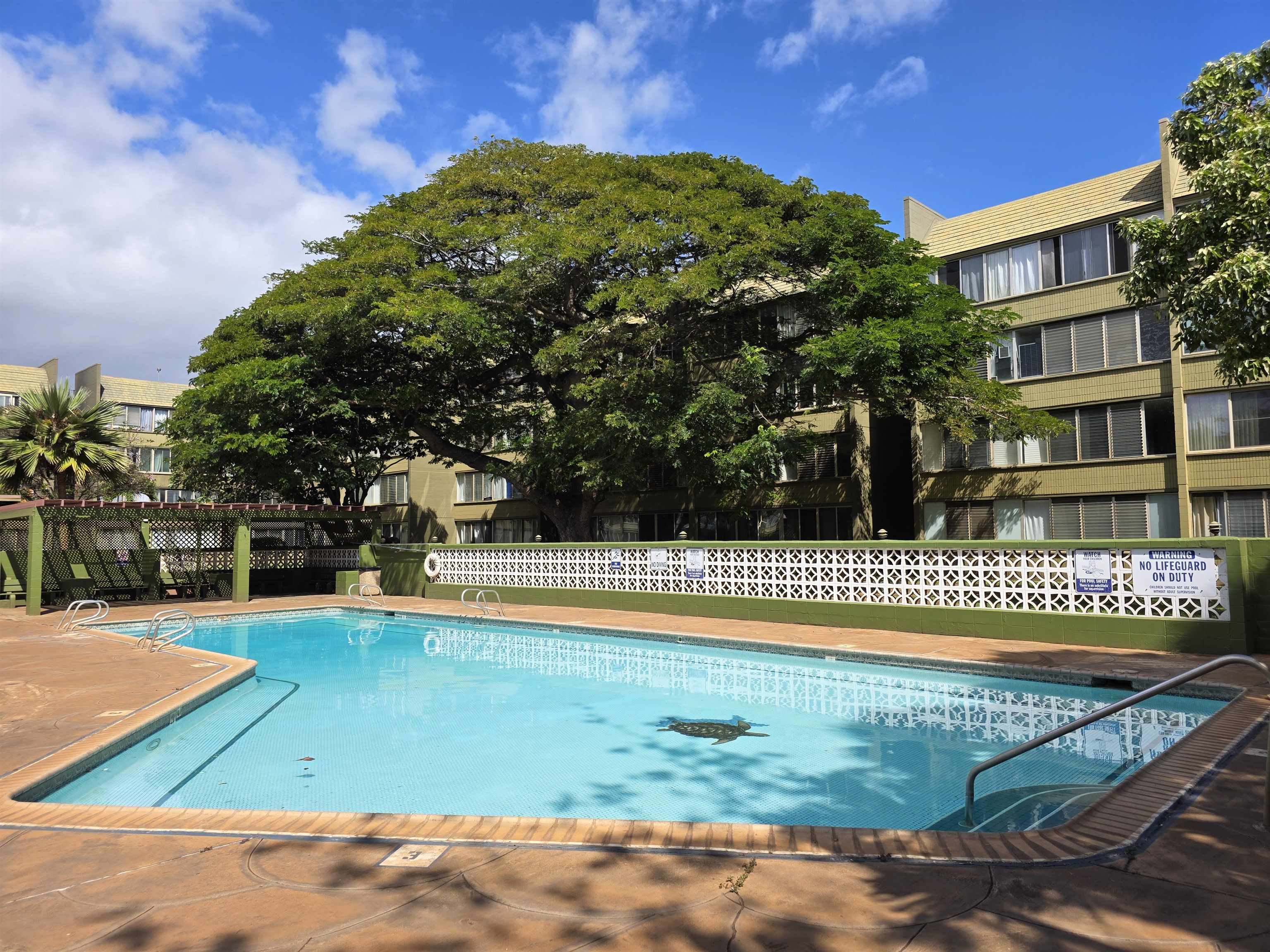 111 Kahului Beach Road, Unit B306 Kahului, HI 96732 - Photo 24 of 29 a view of a swimming pool with an outdoor space and seating area