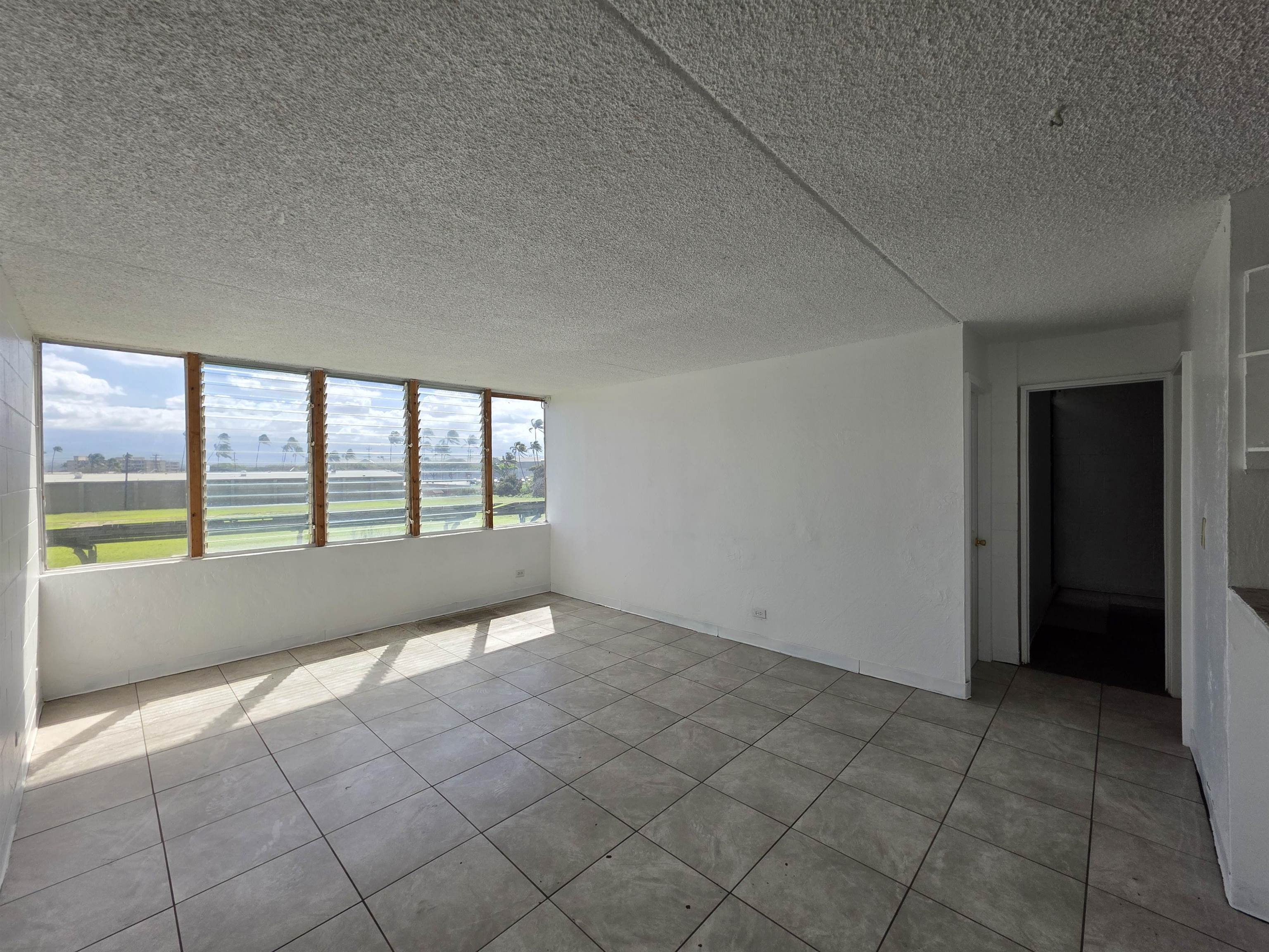 111 Kahului Beach Road, Unit B306 Kahului, HI 96732 - Photo 6 of 29 an empty room with windows