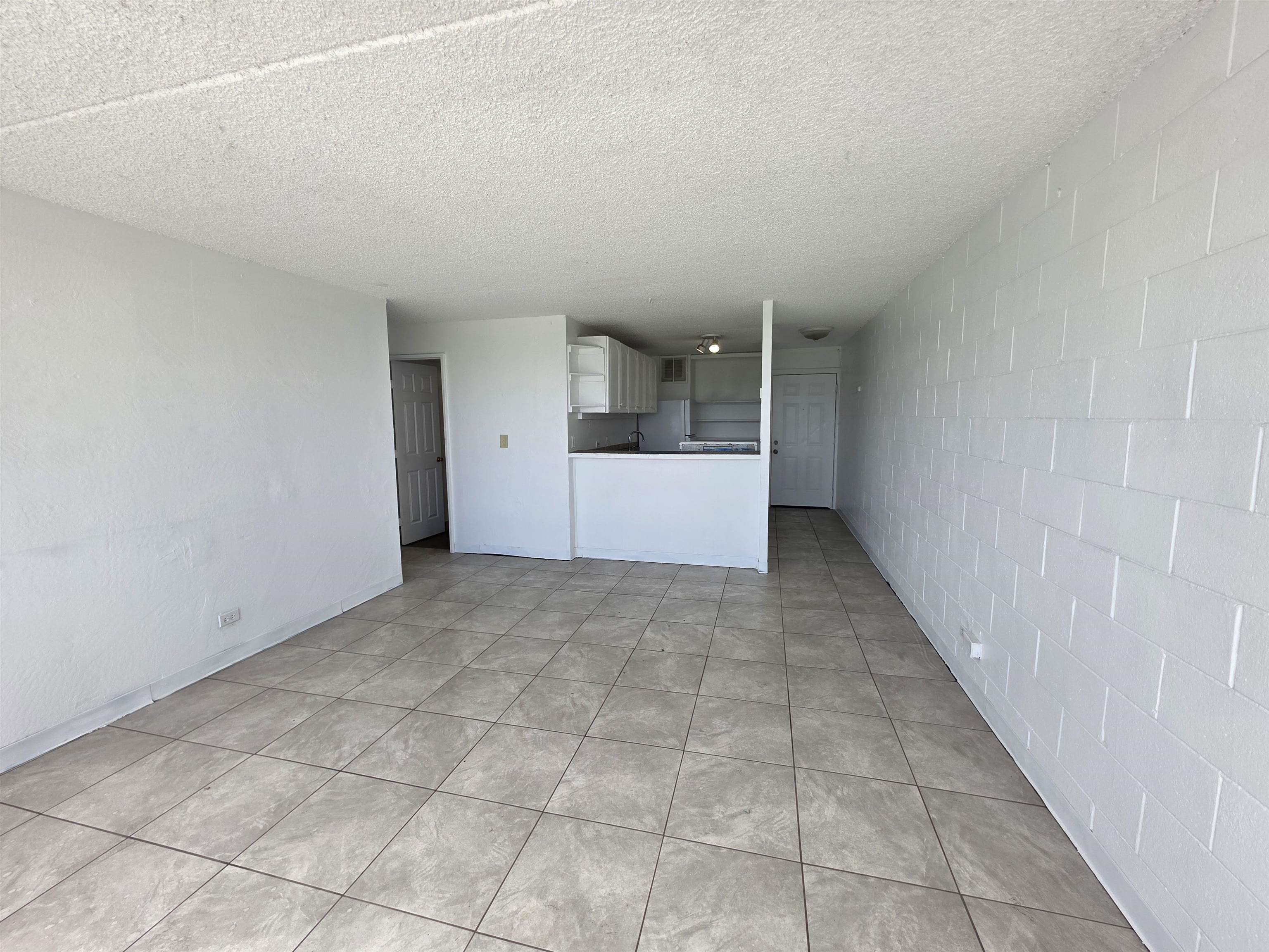 111 Kahului Beach Road, Unit B306 Kahului, HI 96732 - Photo 8 of 29 an empty room with kitchen