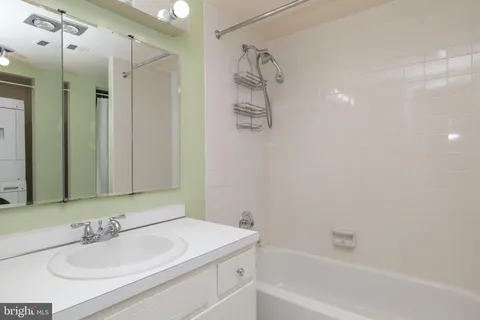 a bedroom with a large bed and a couch