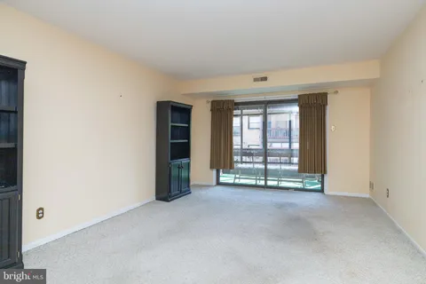 a kitchen with granite countertop a sink stove and refrigerator
