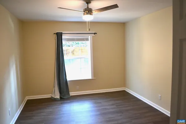 a view of front door with wooden floor