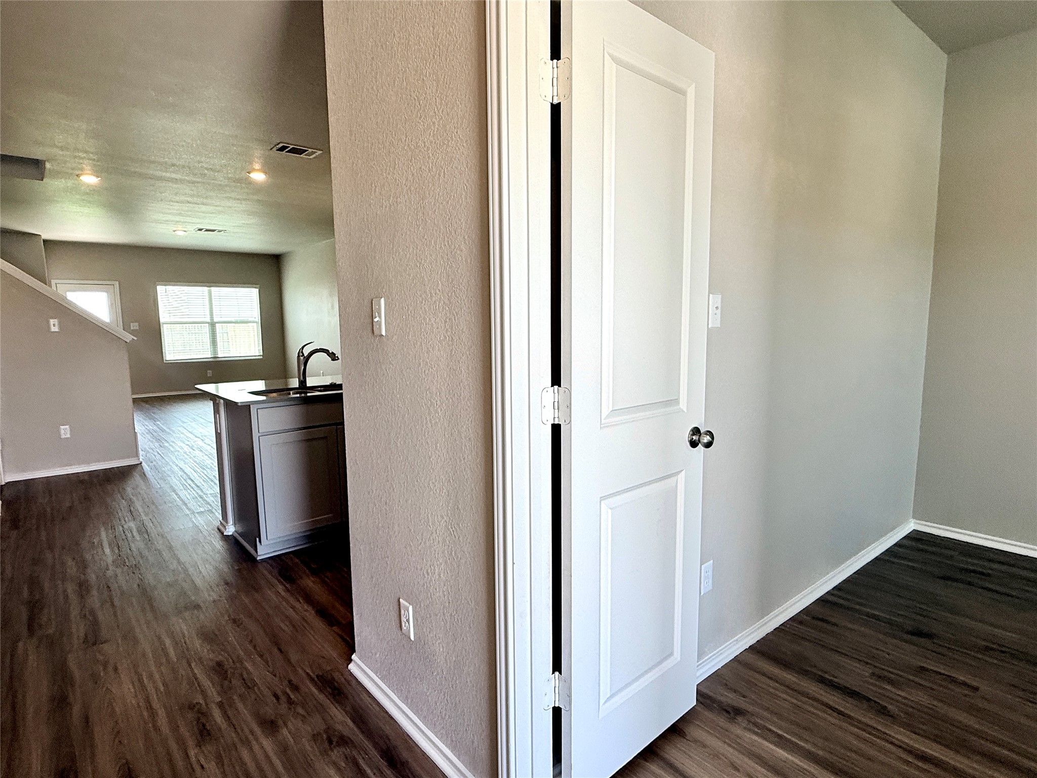 129 Perfect World Loop Jarrell, TX 76537 - Photo 29 of 31 Rich wood flooring seamlessly connects the inviting living spaces.