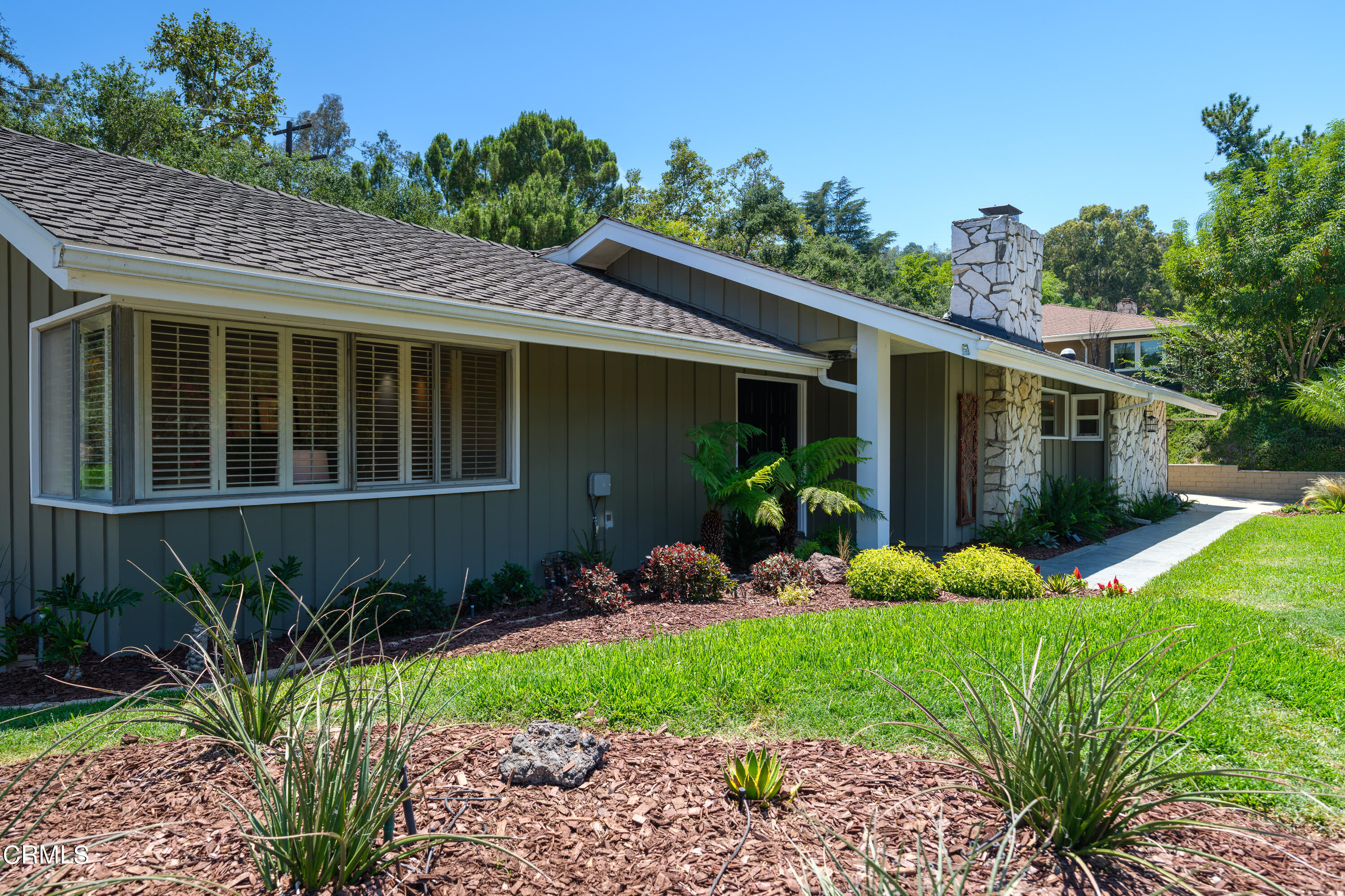 1450 Pegfair Estates Drive Pasadena, CA 91103 - Photo 1 of 58 a front view of a house with garden