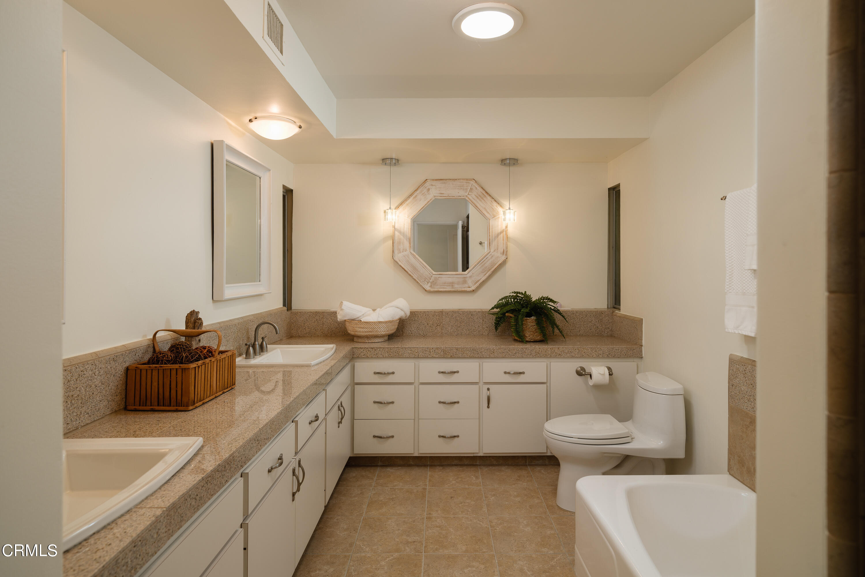 1450 Pegfair Estates Drive Pasadena, CA 91103 - Photo 28 of 58 a spacious bathroom with a double vanity sink toilet mirror and bathtub