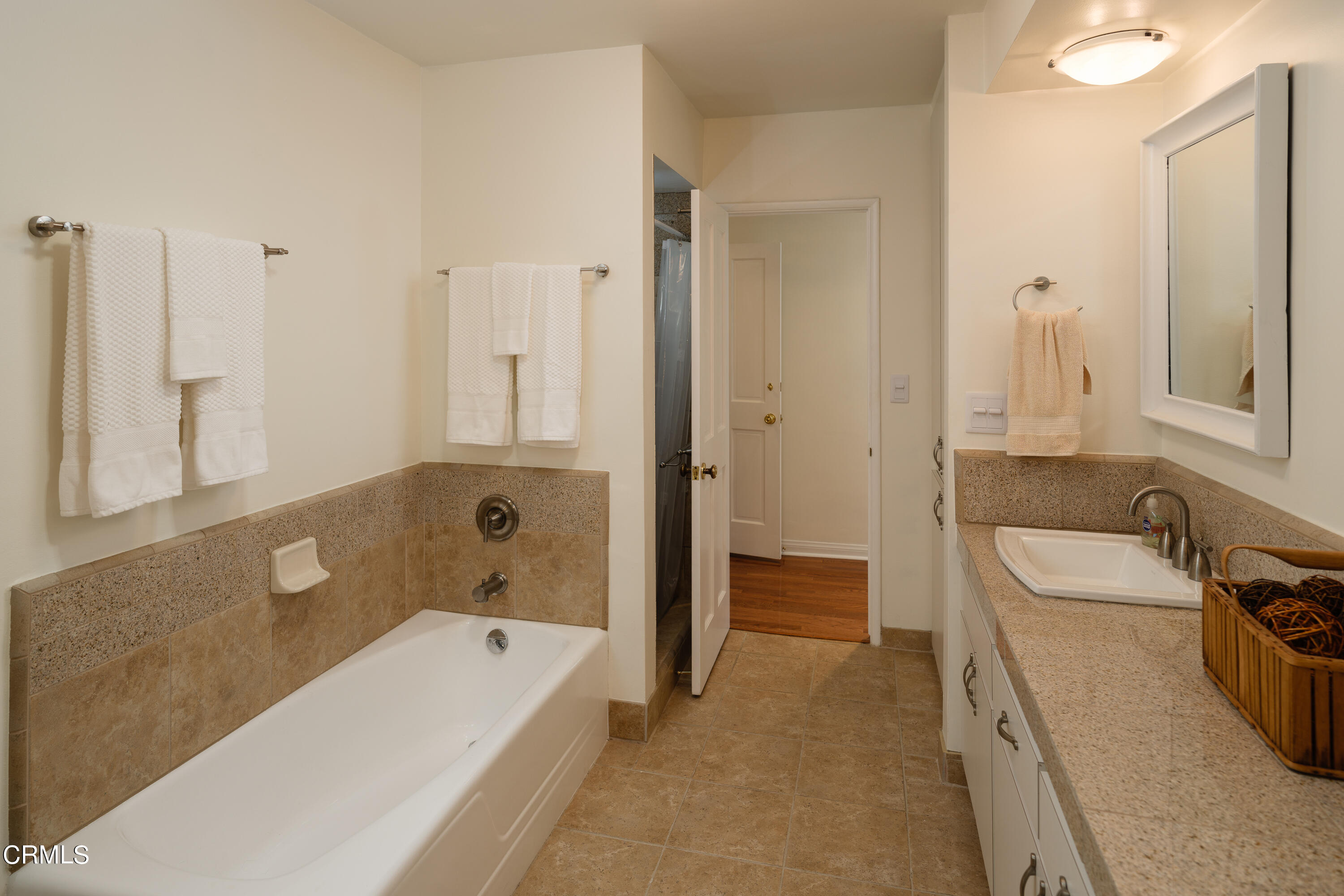 1450 Pegfair Estates Drive Pasadena, CA 91103 - Photo 29 of 58 a bathroom with a tub a sink and a large mirror