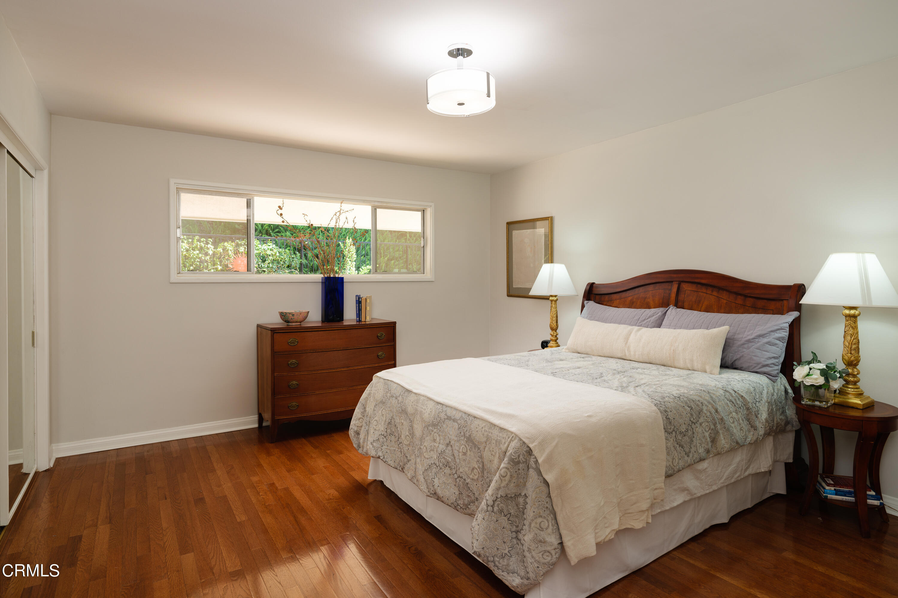 1450 Pegfair Estates Drive Pasadena, CA 91103 - Photo 33 of 58 a bedroom with a bed and a lamp