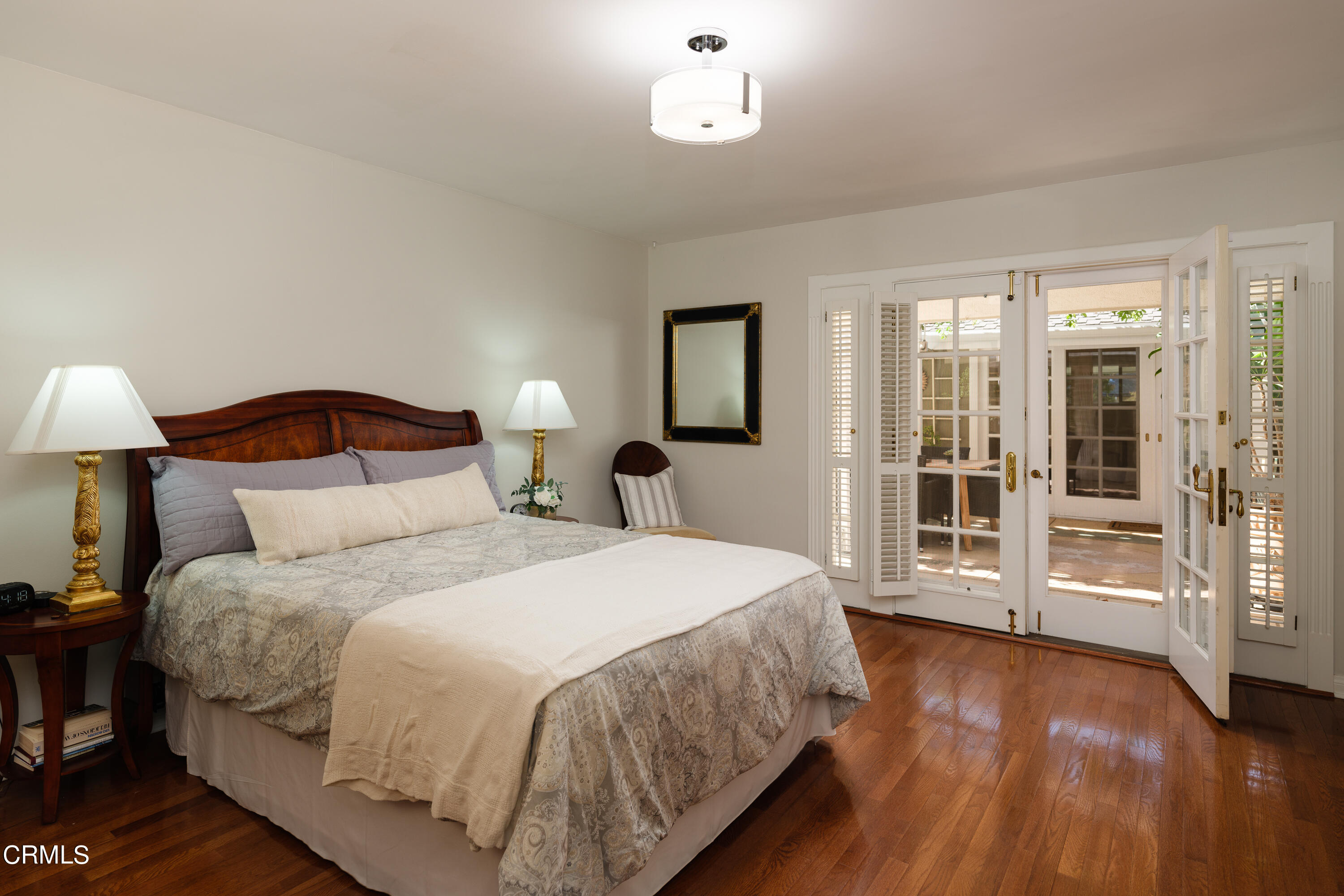 1450 Pegfair Estates Drive Pasadena, CA 91103 - Photo 34 of 58 a bedroom with a large bed and a lamp on table