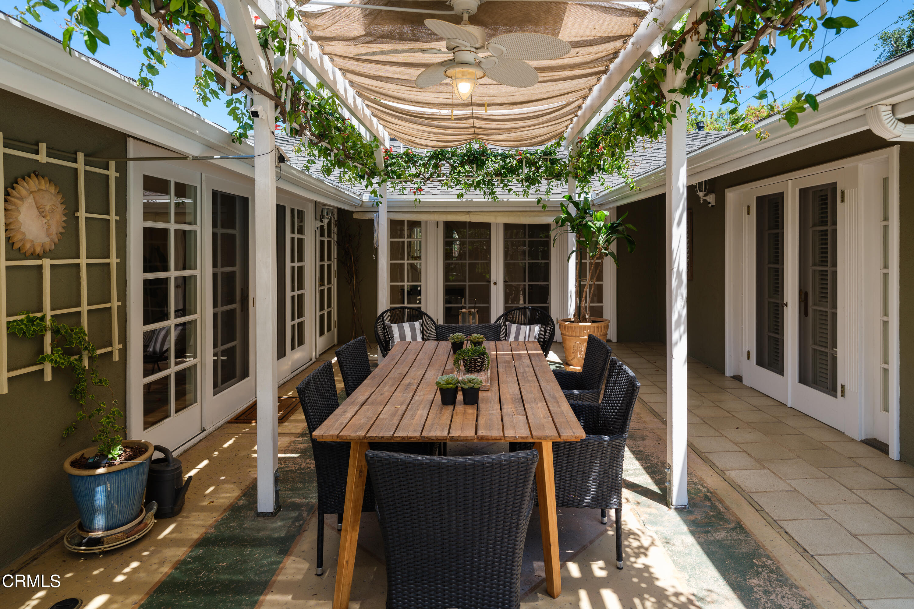1450 Pegfair Estates Drive Pasadena, CA 91103 - Photo 38 of 58 a view of a patio with table and chairs and potted plants