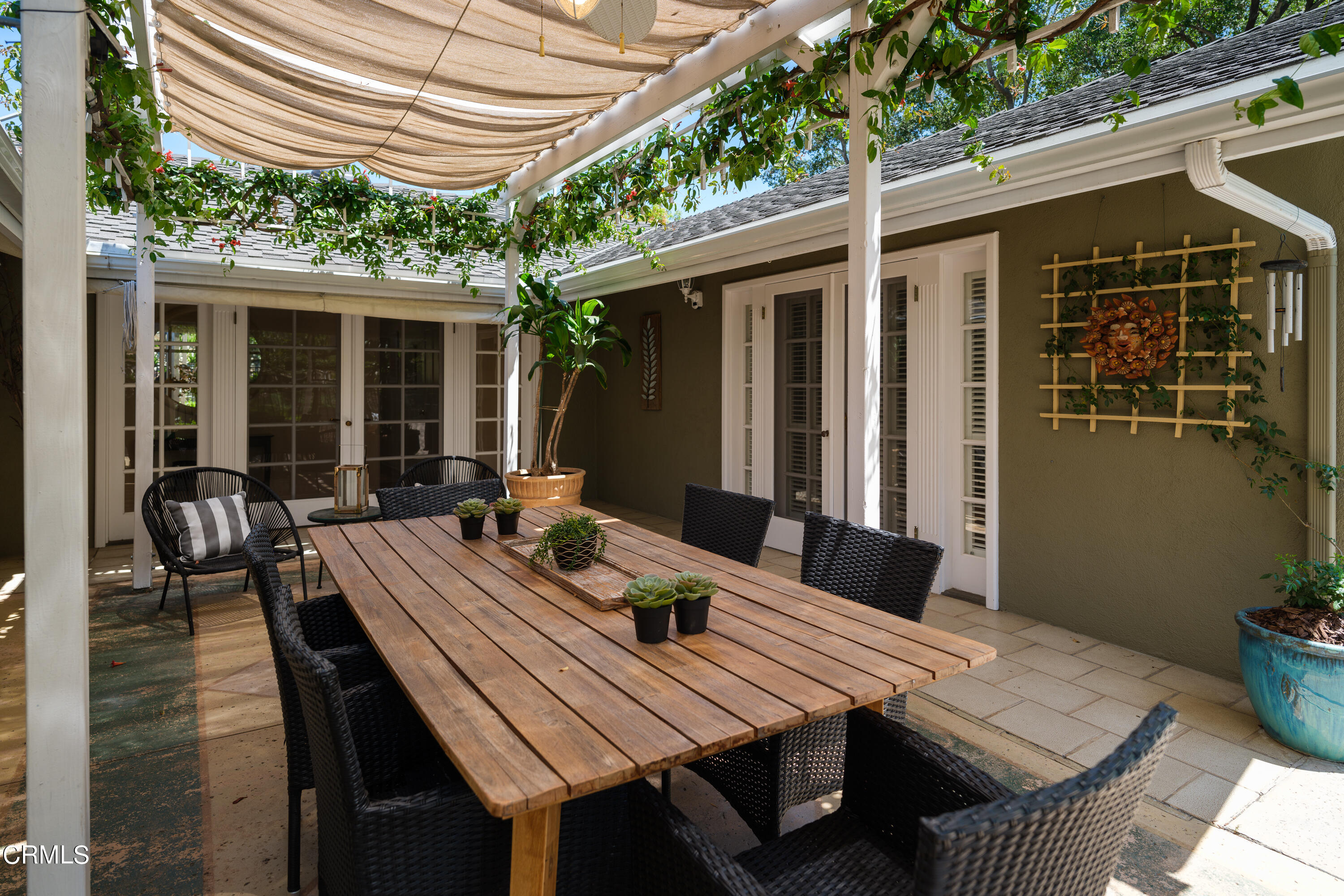1450 Pegfair Estates Drive Pasadena, CA 91103 - Photo 39 of 58 a view of a patio with table and chairs with wooden floor and fence